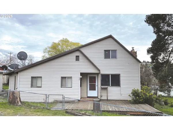 a front view of a house with yard