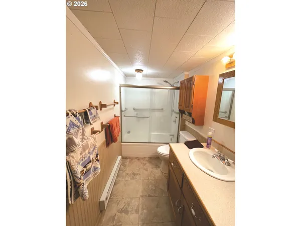 a bath room with a sink and a mirror