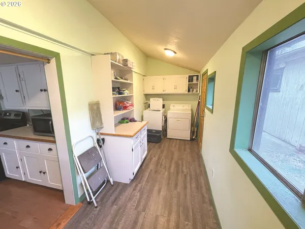 a view of a kitchen with storage and utility
