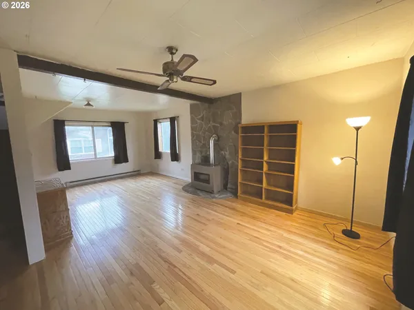a view of a livingroom with furniture and a ceiling fan