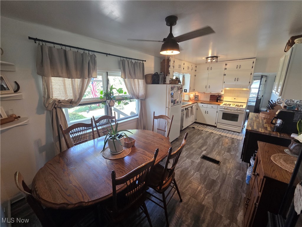 1960 Bellview Road Cambridge, OH 43725 - Photo 15 of 27 Dining space featuring ceiling fan and dark wood finished floors