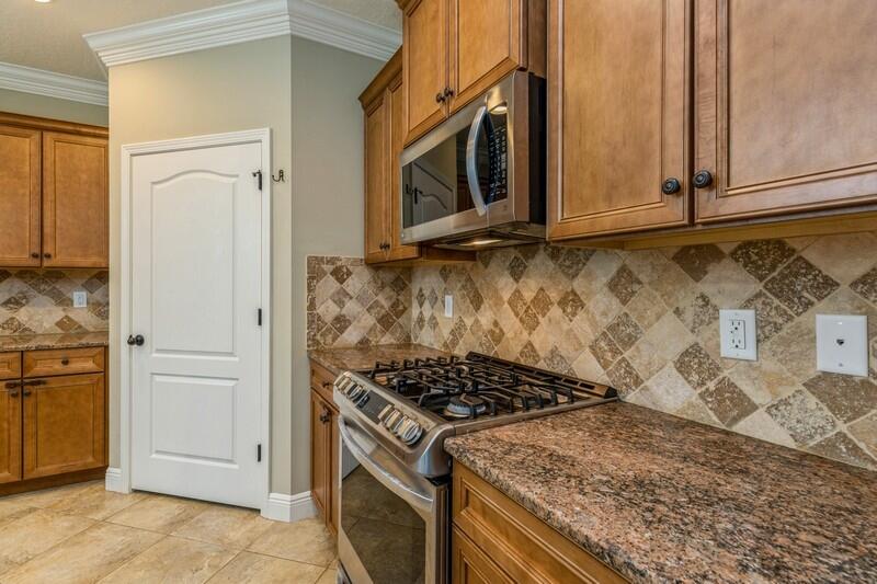 4609 Hermosa Road Crestview, FL 32539 - Photo 19 of 34 a kitchen with a stove and a microwave