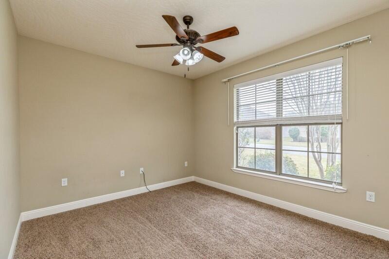 4609 Hermosa Road Crestview, FL 32539 - Photo 23 of 34 an empty room with window and ceiling fan