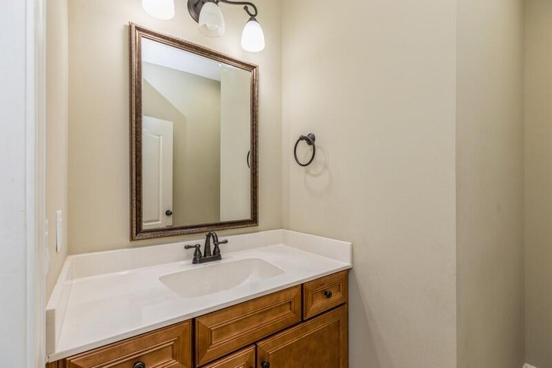 4609 Hermosa Road Crestview, FL 32539 - Photo 25 of 34 a bathroom with a sink and a mirror