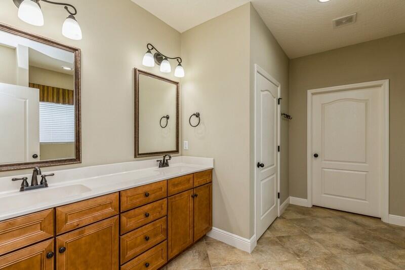 4609 Hermosa Road Crestview, FL 32539 - Photo 29 of 34 a spacious bathroom with a granite countertop sink mirror and double