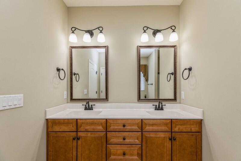4609 Hermosa Road Crestview, FL 32539 - Photo 30 of 34 a bathroom with double vanity sinks and a mirror