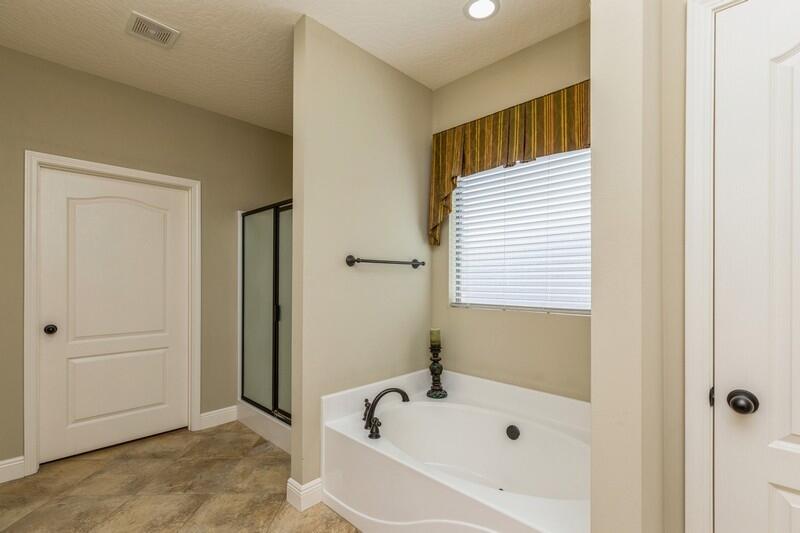 4609 Hermosa Road Crestview, FL 32539 - Photo 31 of 34 a bathroom with a bathtub and a shower