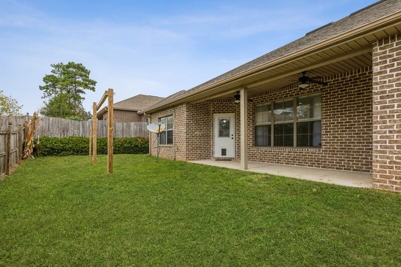 4609 Hermosa Road Crestview, FL 32539 - Photo 34 of 34 a view of a house with a backyard