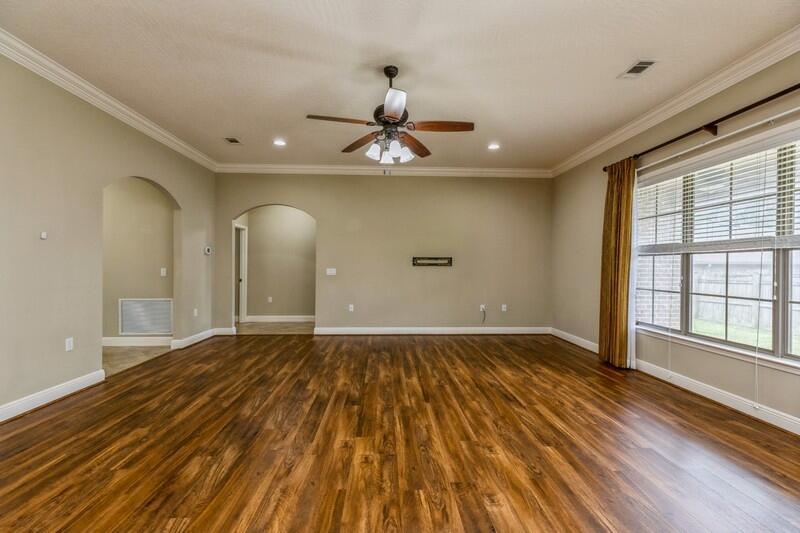 4609 Hermosa Road Crestview, FL 32539 - Photo 10 of 34 a view of empty room with wooden floor and fan