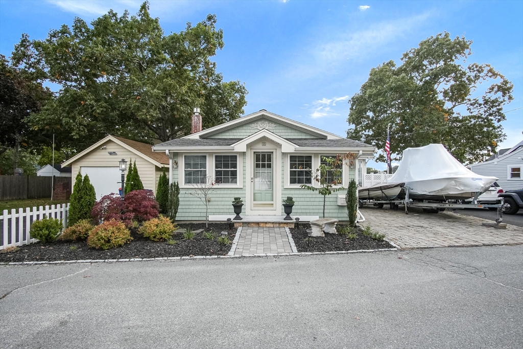 77 Circuit Avenue Wareham, MA 02571 - Photo 1 of 39 a front view of a house with a yard and garage