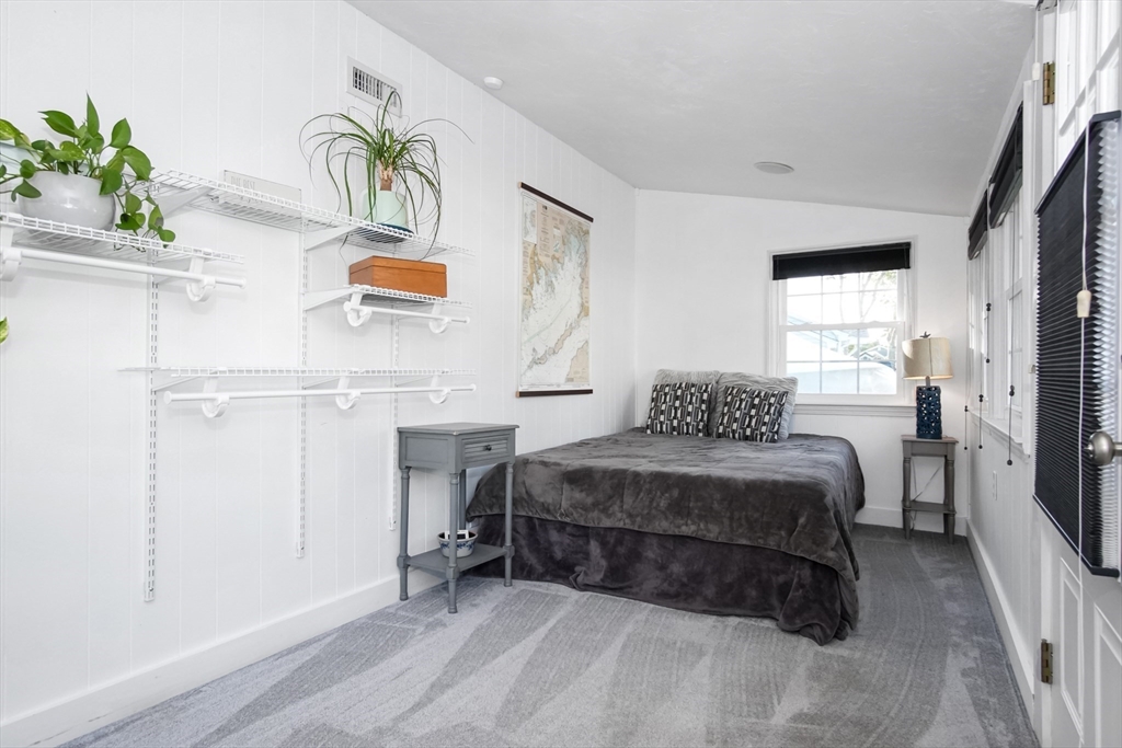 77 Circuit Avenue Wareham, MA 02571 - Photo 13 of 39 a spacious bedroom with a bed and a window