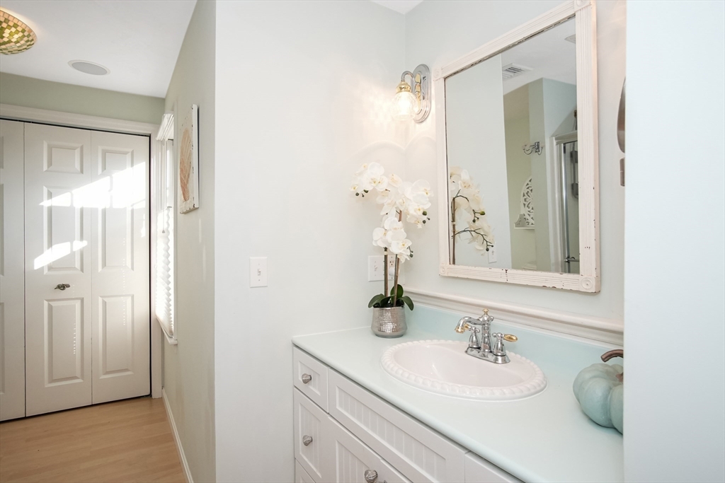 77 Circuit Avenue Wareham, MA 02571 - Photo 24 of 39 a bathroom with a granite countertop sink and a mirror