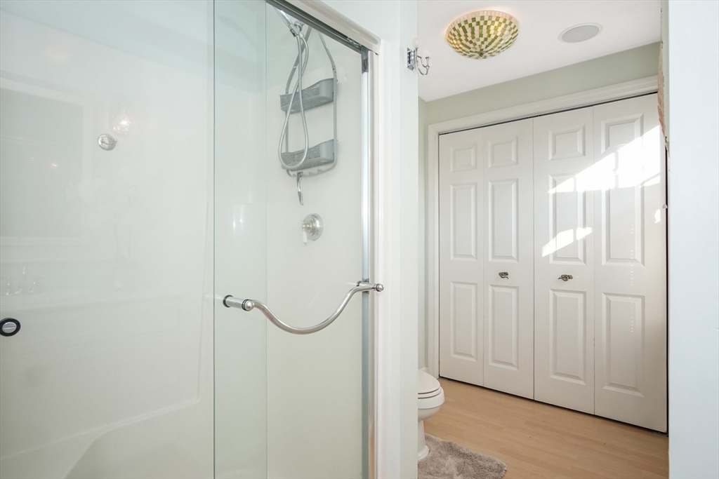 77 Circuit Avenue Wareham, MA 02571 - Photo 26 of 39 a bathroom with a glass shower door