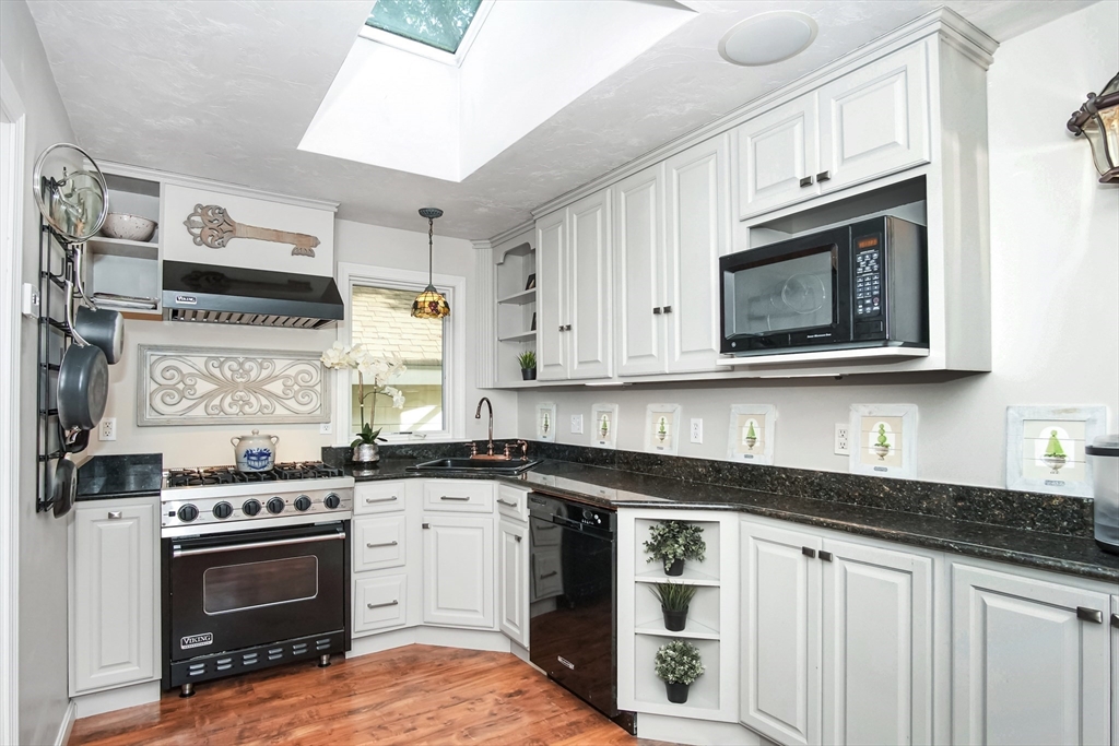 77 Circuit Avenue Wareham, MA 02571 - Photo 7 of 39 a kitchen with stainless steel appliances granite countertop a stove a sink and a microwave
