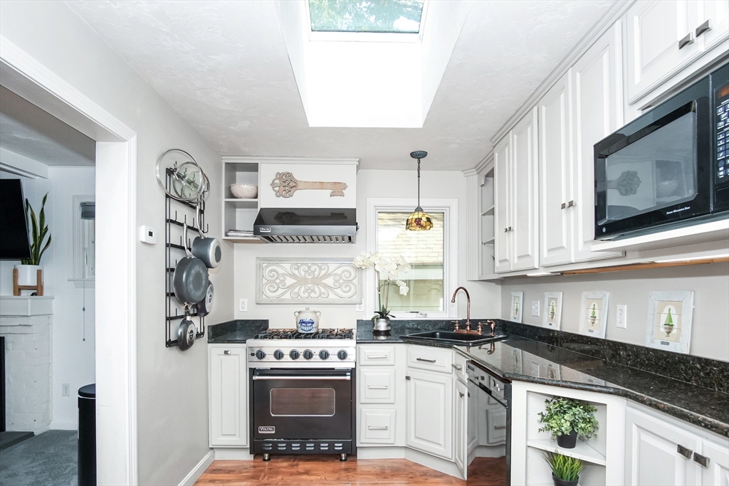 77 Circuit Avenue Wareham, MA 02571 - Photo 8 of 39 a kitchen with stainless steel appliances granite countertop a stove a sink and a microwave