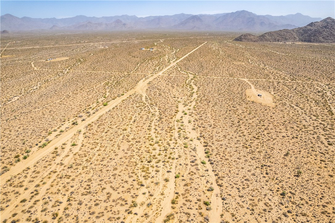 0 East Arroyo Road Yucca, AZ 86438 - Photo 12 of 25 Expansive desert landscape featuring natural terrain and distant mountains