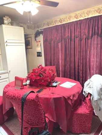 a bedroom with a bed and a table