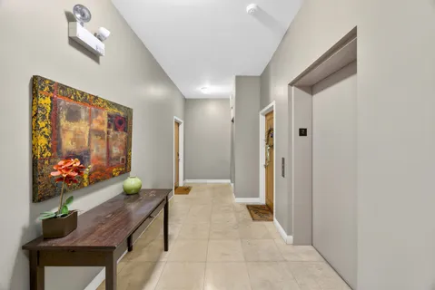 a living room with furniture and flowers