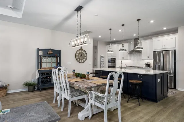 an aerial view of a house with swimming pool garden and lake view