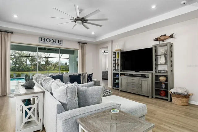 a view of a house with a yard and potted plants