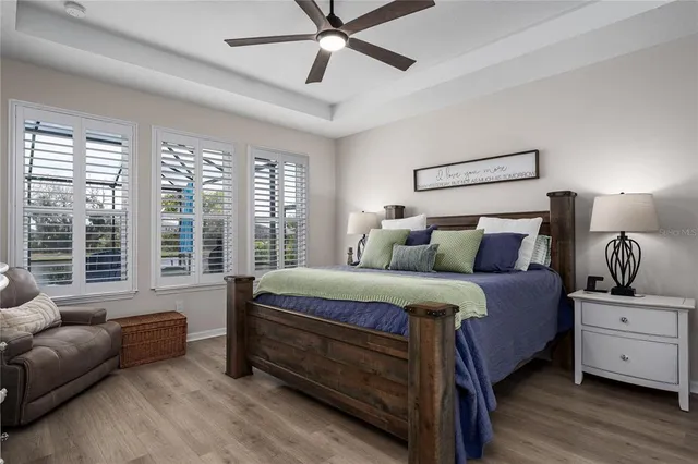 a view of a lake with houses in the back