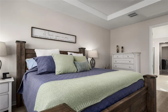 a view of a backyard with plants and lake view