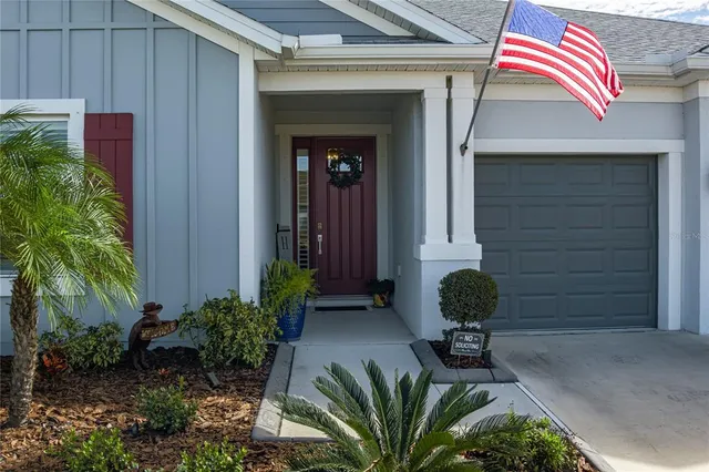 a view of a backyard with sitting area