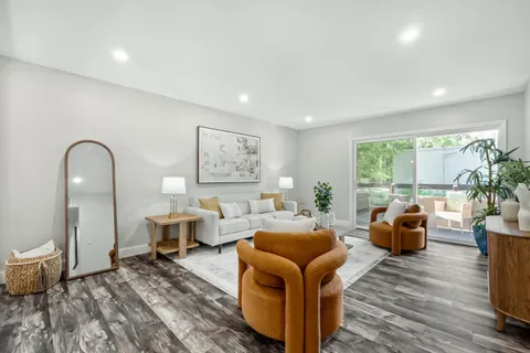 a living room with furniture or couch and a window