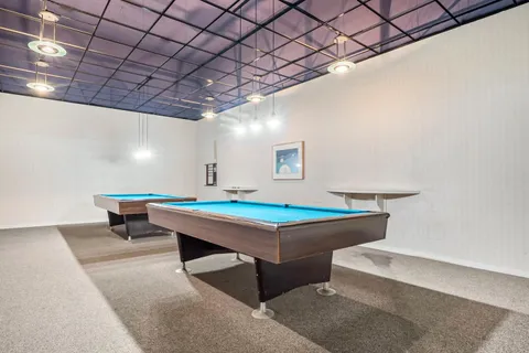 a room with furniture and wooden walls