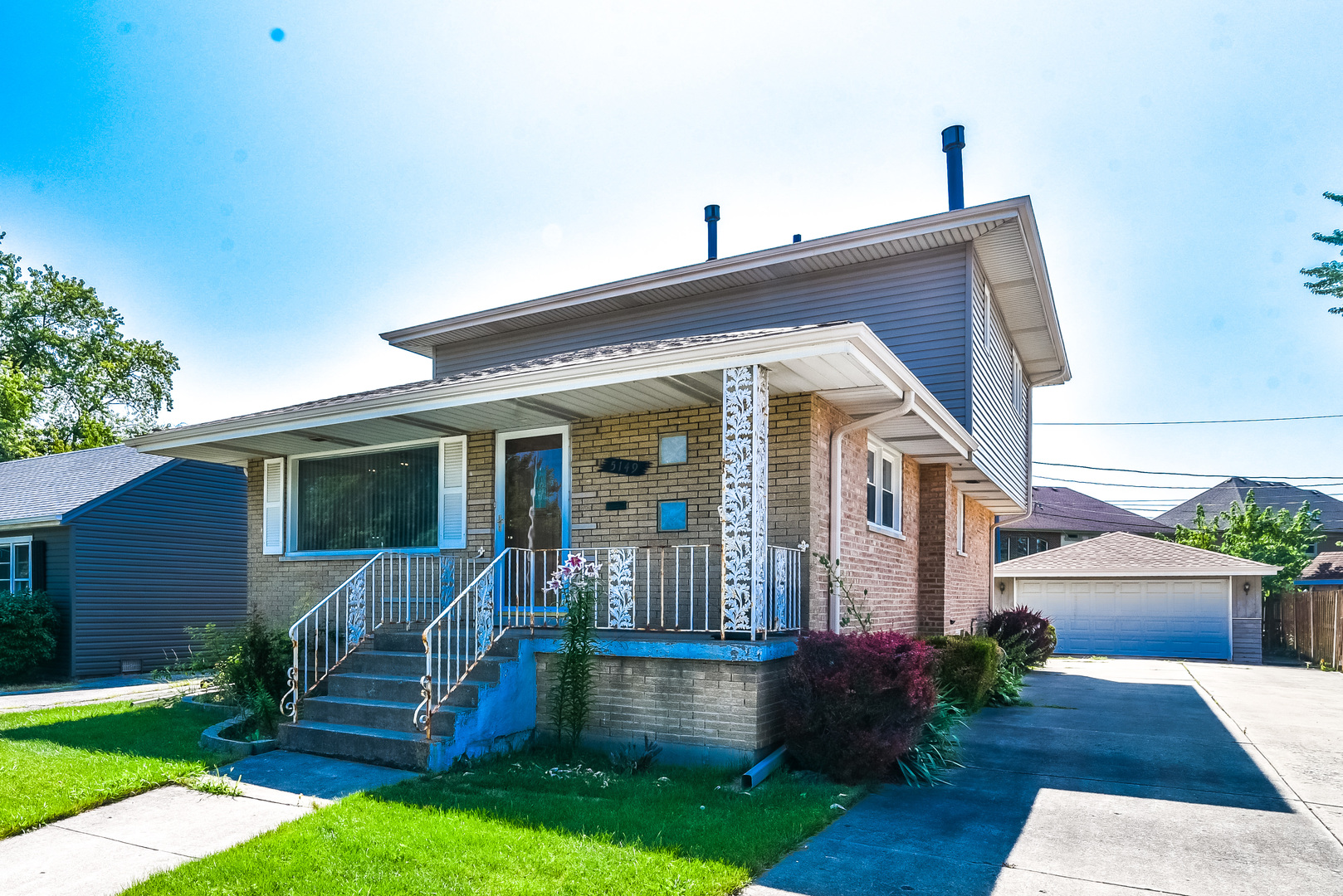 5149 State Road Burbank, IL 60459 - Photo 1 of 36 a front view of a house with yard and green space