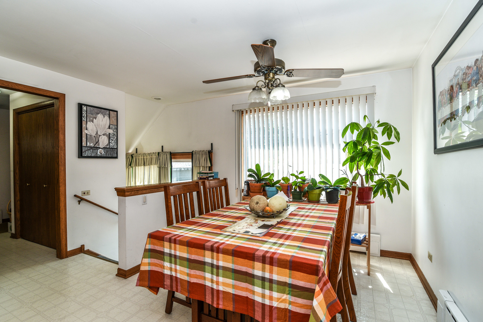 5149 State Road Burbank, IL 60459 - Photo 12 of 36 a bedroom with a bed table and a potted plant