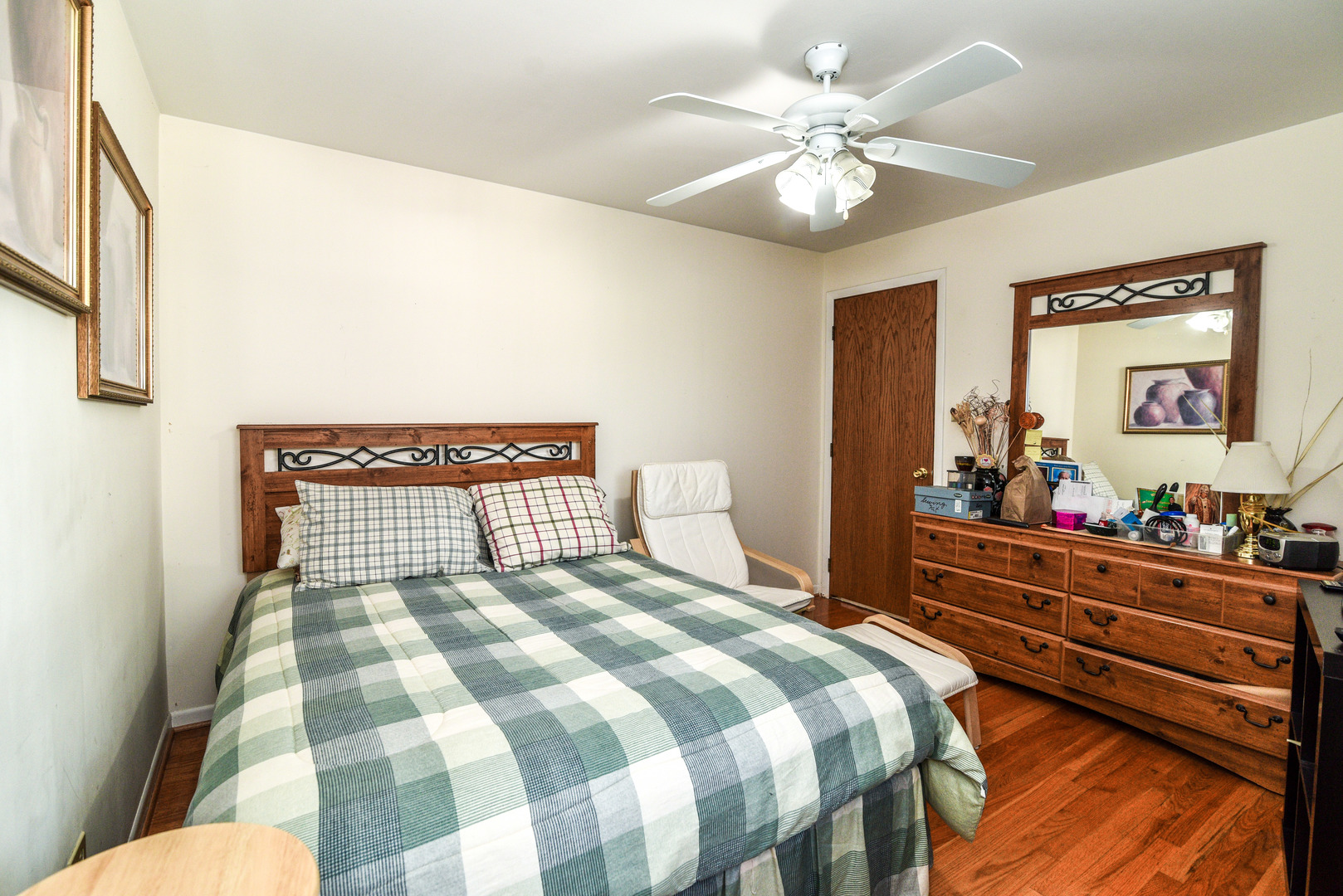 5149 State Road Burbank, IL 60459 - Photo 15 of 36 a bedroom with a bed and a chandelier