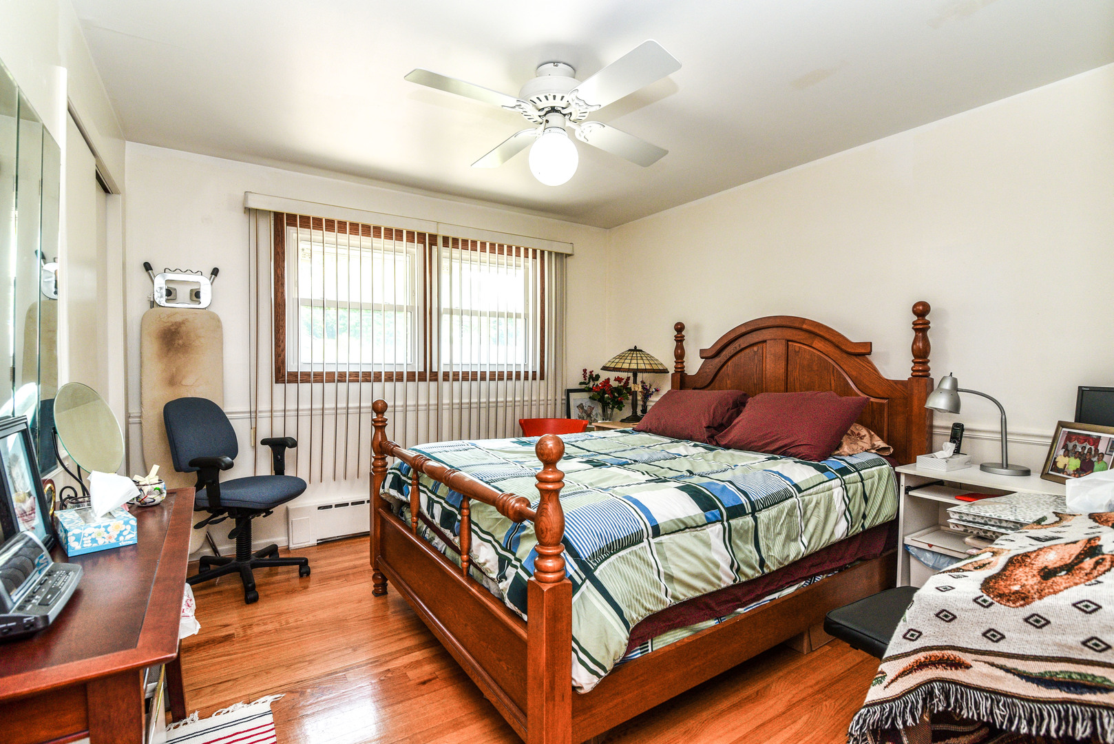 5149 State Road Burbank, IL 60459 - Photo 16 of 36 a bedroom with a bed and a chandelier