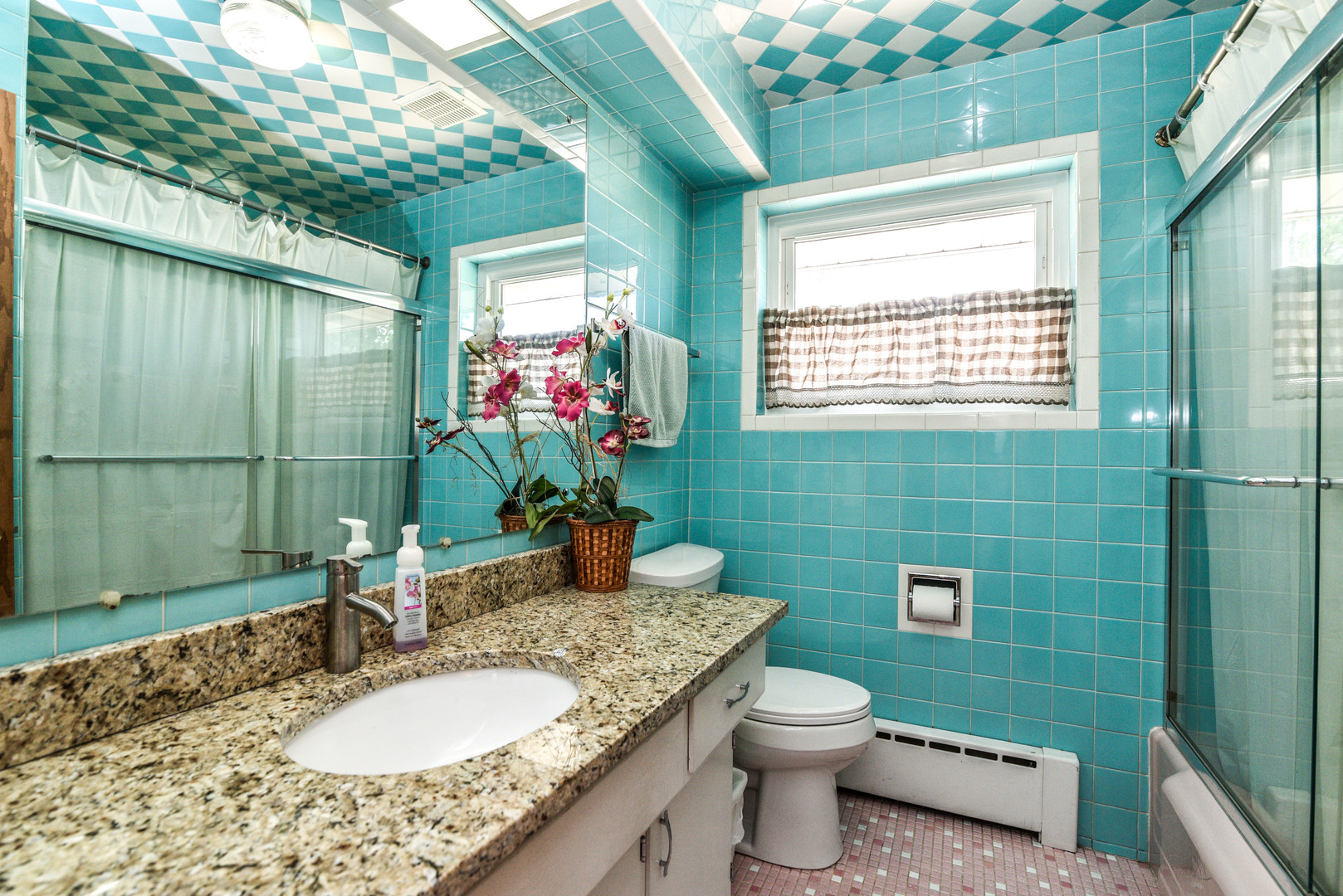 5149 State Road Burbank, IL 60459 - Photo 18 of 36 a bathroom with a granite countertop toilet a sink and a mirror