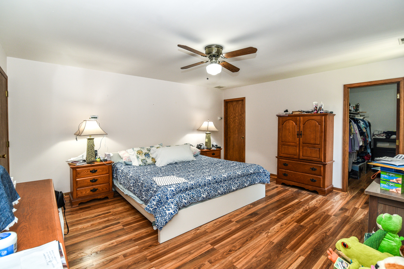 5149 State Road Burbank, IL 60459 - Photo 19 of 36 a bedroom with a bed and wooden floor