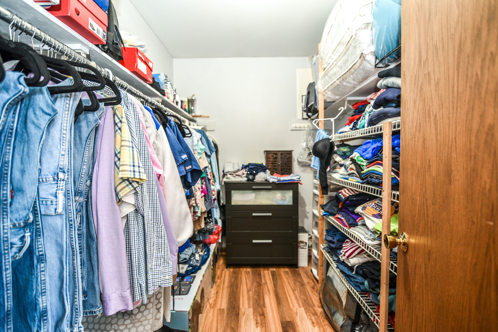 5149 State Road Burbank, IL 60459 - Photo 21 of 36 a view of walk in closet with clothes