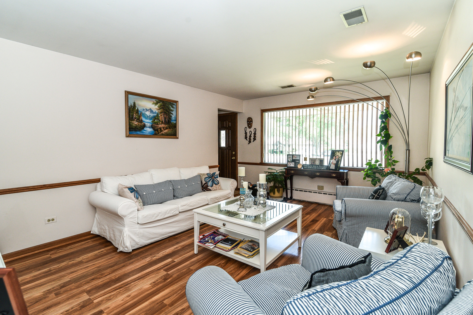 5149 State Road Burbank, IL 60459 - Photo 5 of 36 a living room with furniture and a large window
