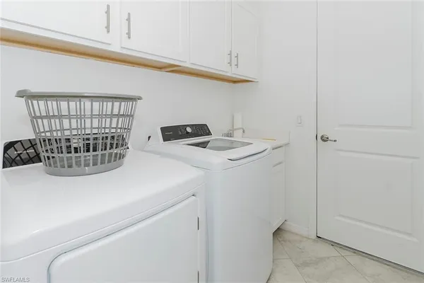 a kitchen with a sink and a stove