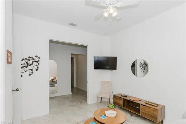 a view of a livingroom with furniture and a flat screen tv