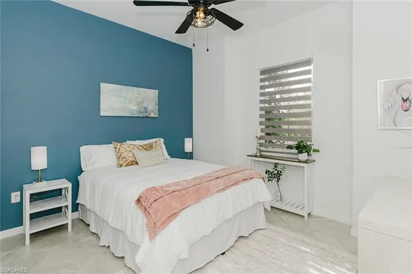 a bedroom with a bed and a table