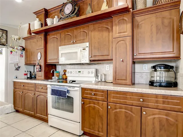 a kitchen with stainless steel appliances granite countertop a sink and cabinets
