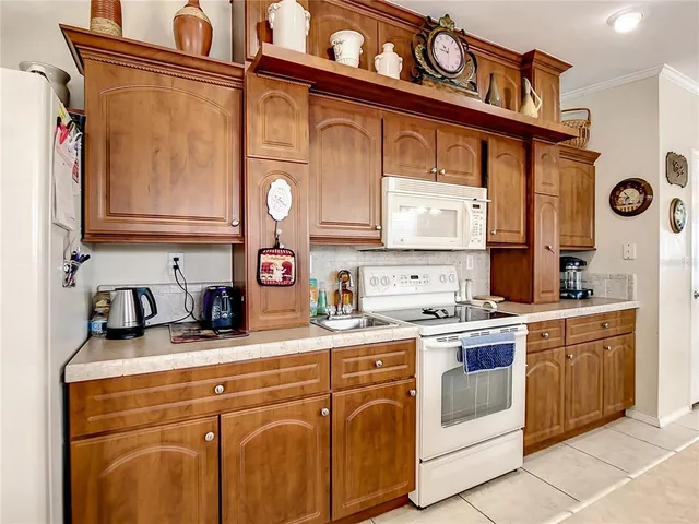 a kitchen with stainless steel appliances granite countertop a sink and cabinets