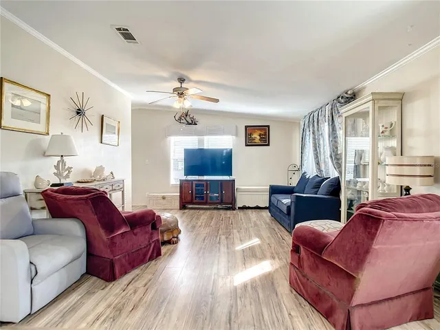 a living room with furniture or couch and a wooden floor