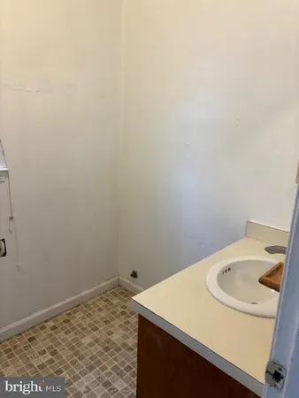 a bathroom with a sink and vanity