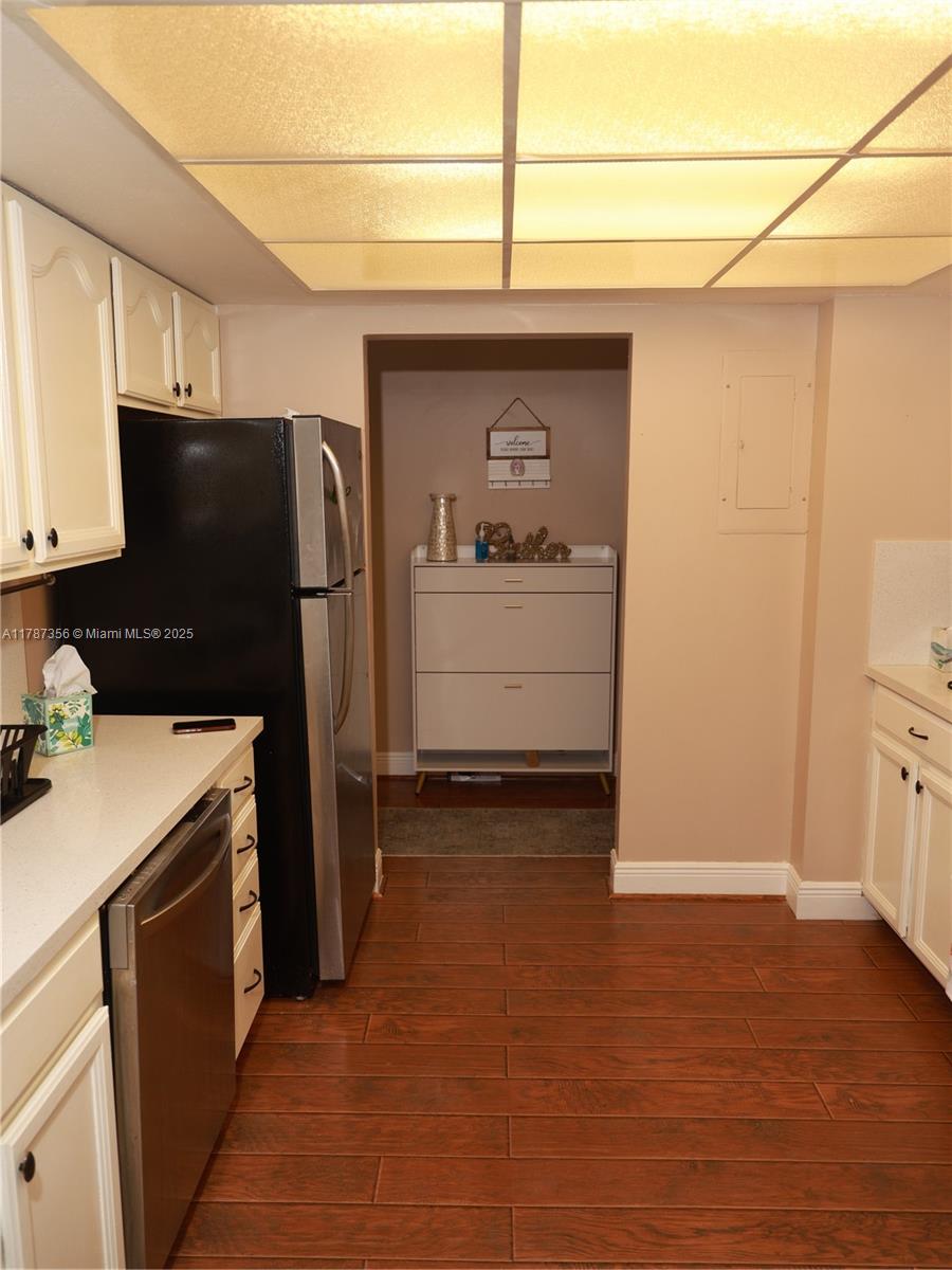 Inverrary Lauderhill, FL 33319 - Photo 11 of 24 a kitchen with a refrigerator and a stove