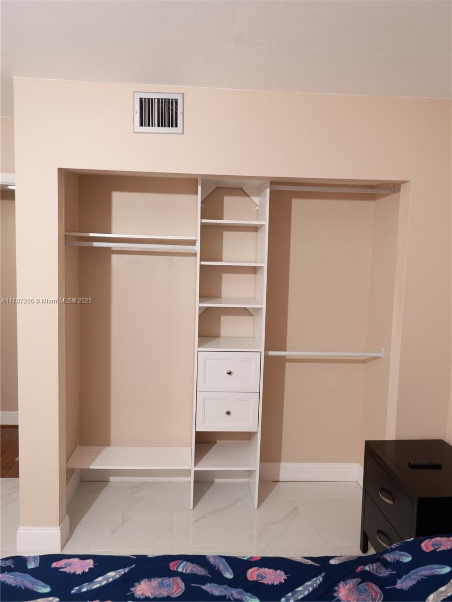 Inverrary Lauderhill, FL 33319 - Photo 19 of 24 a view of an empty room with cabinet and a window