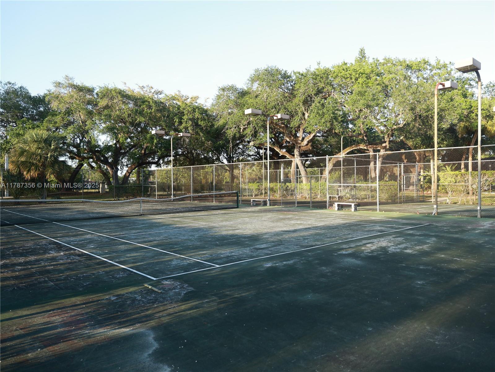 Inverrary Lauderhill, FL 33319 - Photo 2 of 24 a view of a tennis ground with large trees