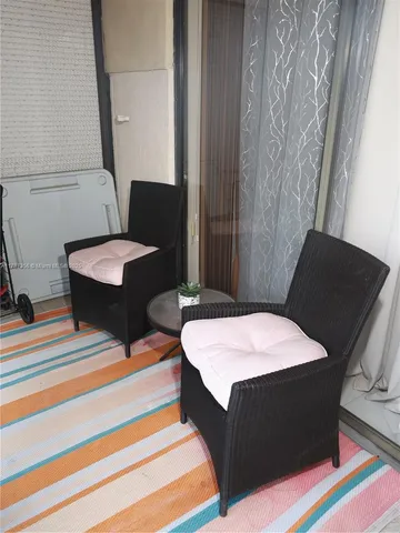 a bedroom with bed and window