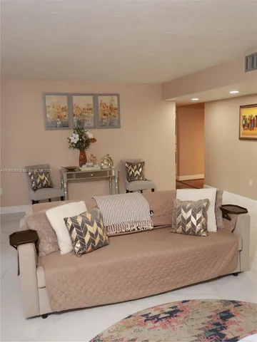 a bedroom with a bed and couch