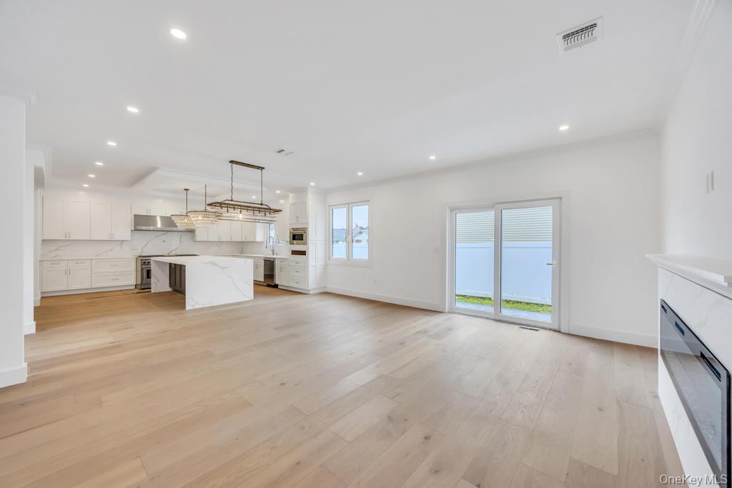 472 Farm Ranch Road East Bethpage, NY 11714 - Photo 13 of 40 a view of a kitchen with a sink and a stove top oven